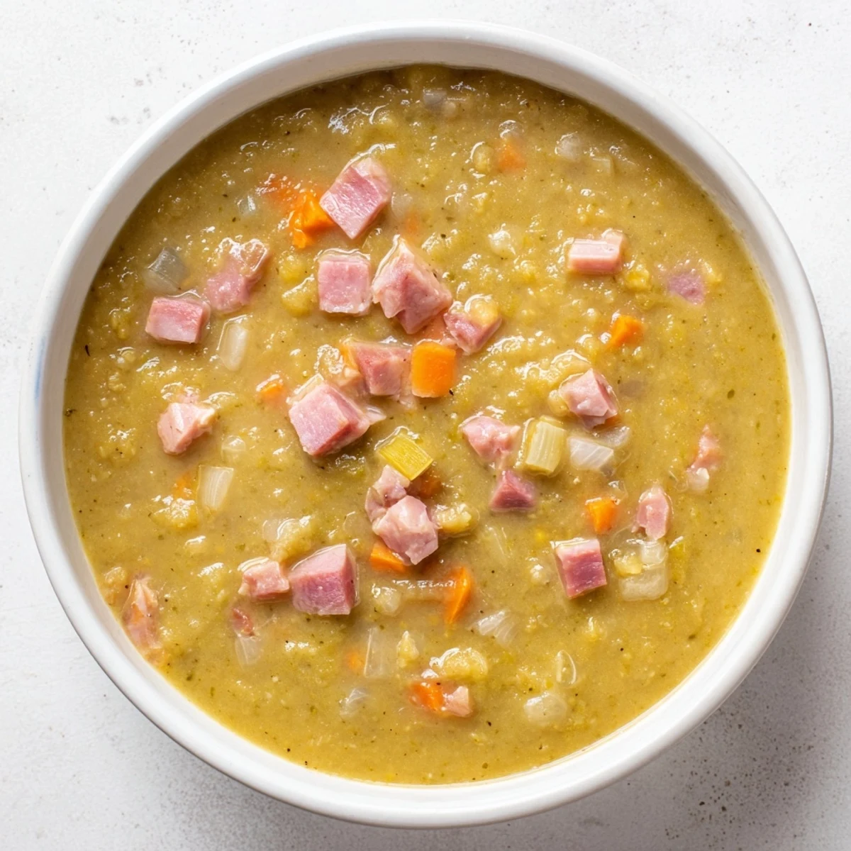 Close-up of Hearty Split Pea and Ham Soup, showcasing a savory, smoky broth and tender ham.