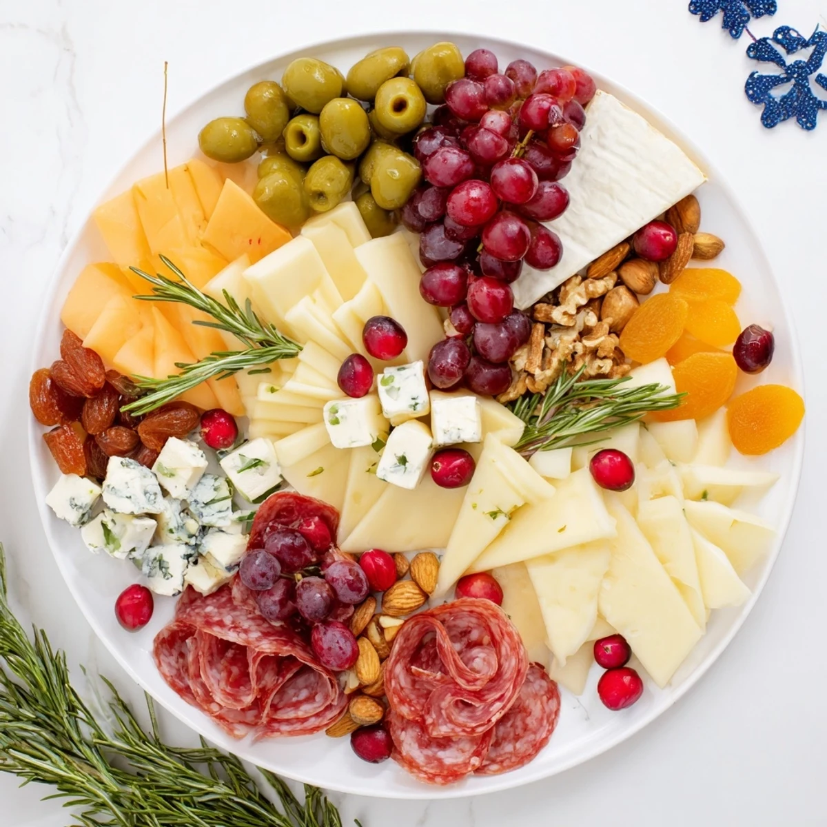Festive Holiday Wreath Cheese Platter, showcasing creamy cheeses, savory meats, and vibrant fruits perfect for entertaining.