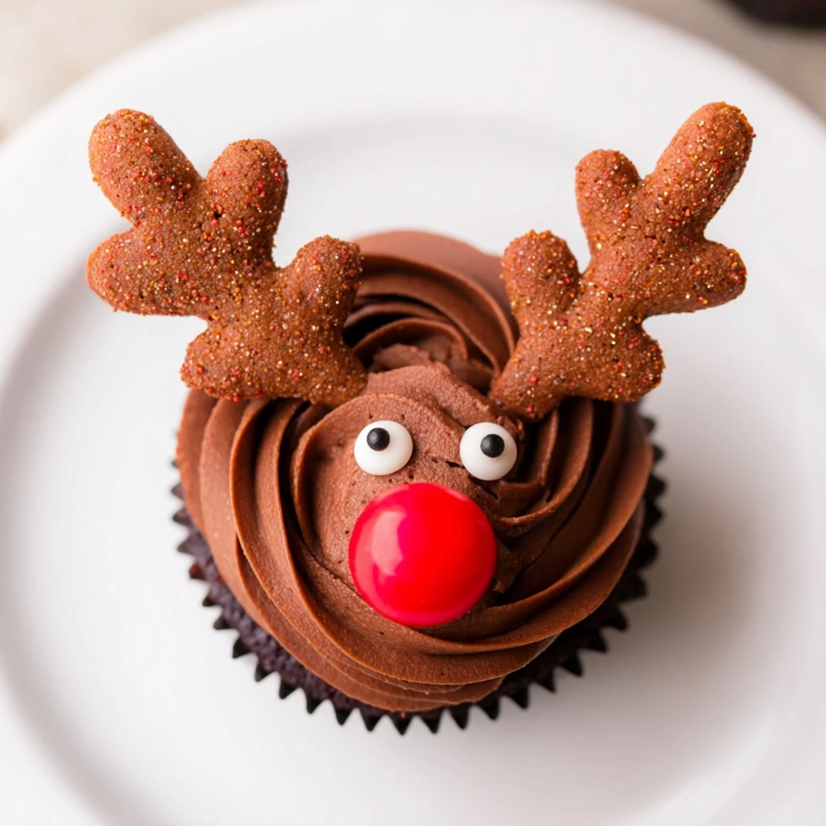 A close-up of a delightful Reindeer Holiday Dessert Platter, featuring gingerbread antlers and candy noses.