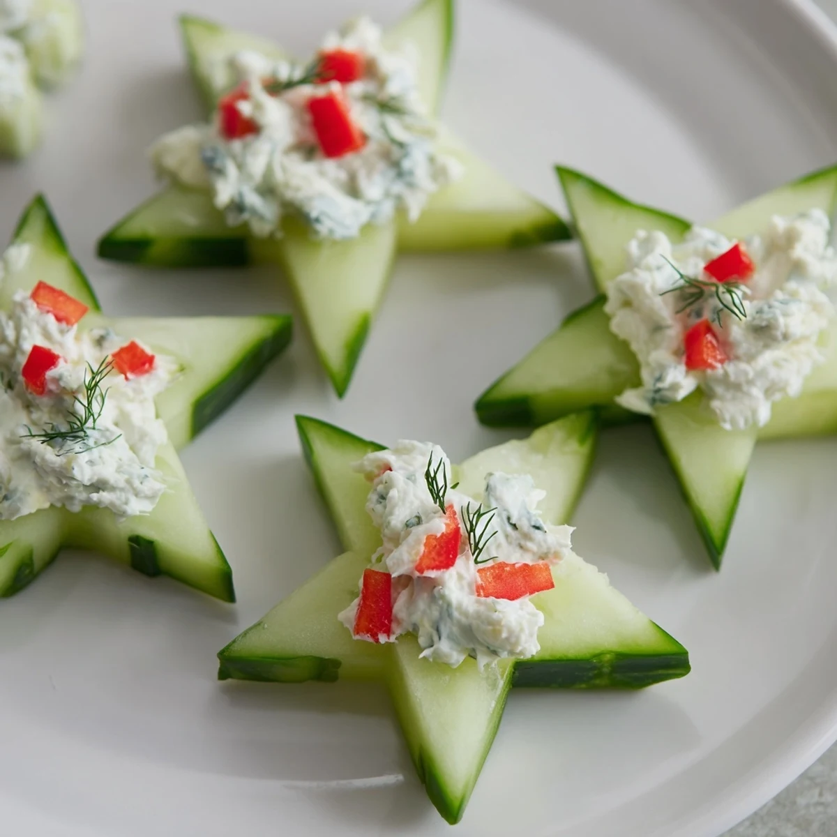 Bright cucumber and dill Christmas stars, a fresh and festive appetizer, ready to serve beautifully.