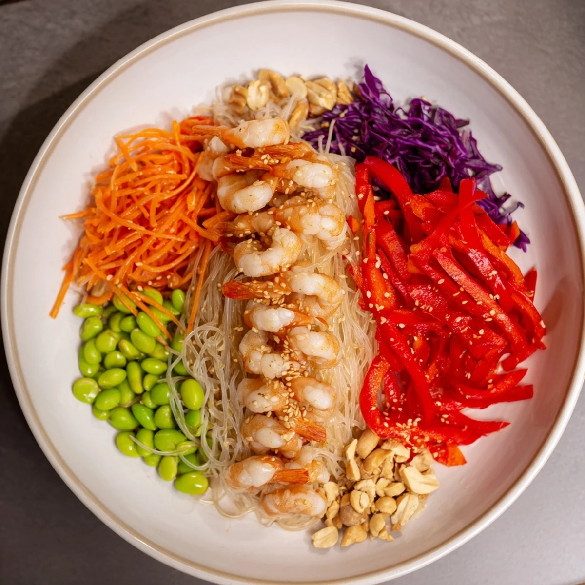 Imagine an Asian Fusion Noodle Bowl Board: perfectly arranged noodles, protein, and colorful vegetables ready to enjoy.