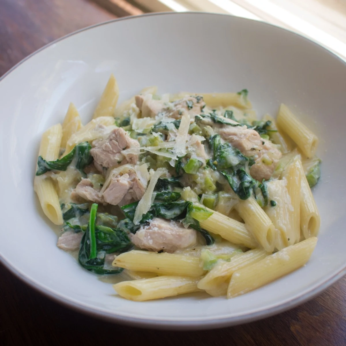 This delicious One-Pot Creamy Spinach & Turkey Christmas Pasta features tender turkey and fresh spinach ready to enjoy.