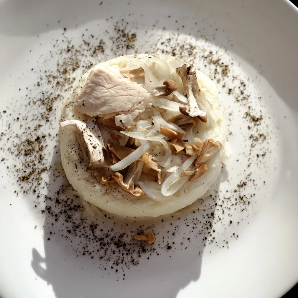 The Ghostly Gala features pearly poached chicken atop creamy cauliflower, a sophisticated main.