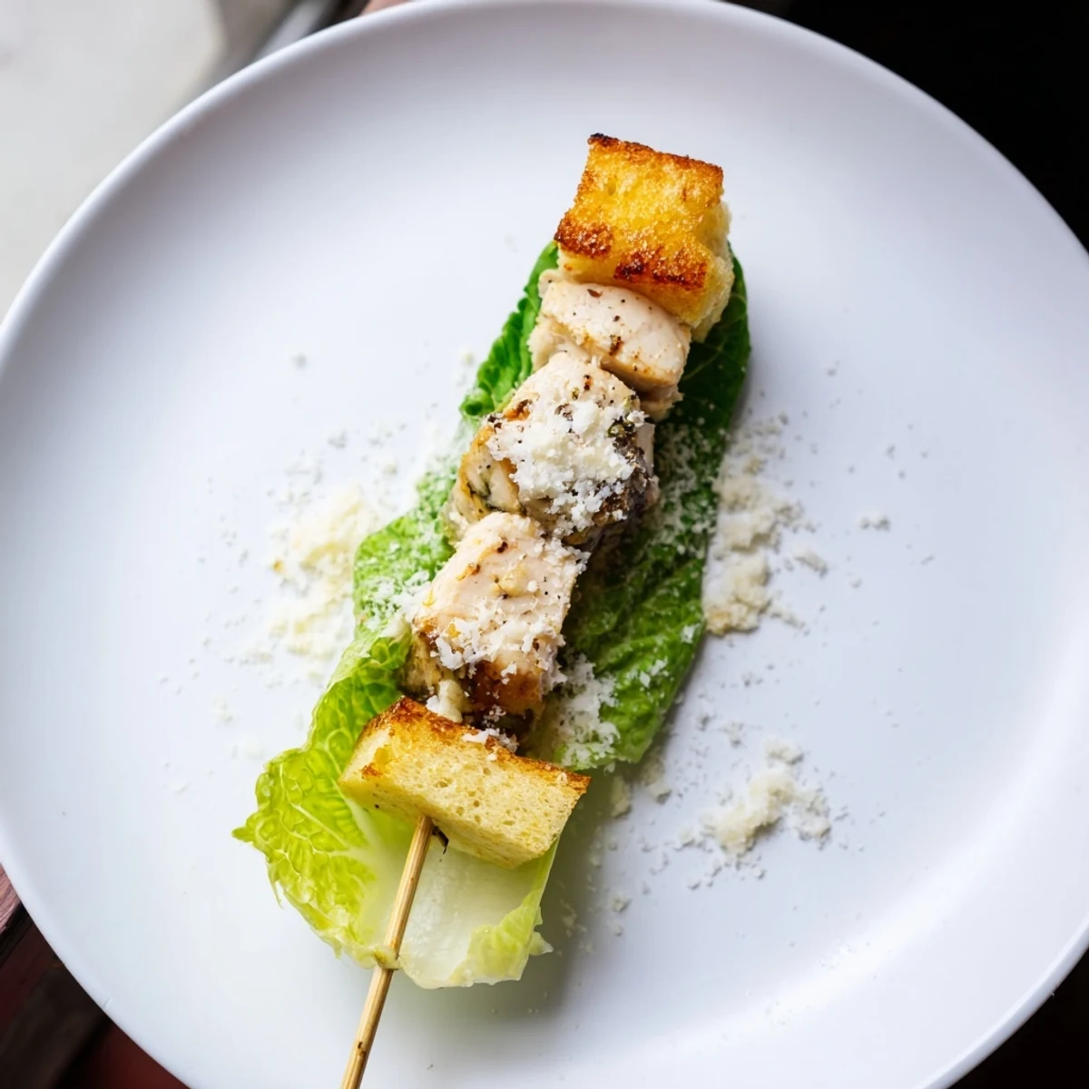 Delicious Chicken Caesar Salad Skewers feature perfectly grilled chicken and crunchy croutons, ideal for parties.