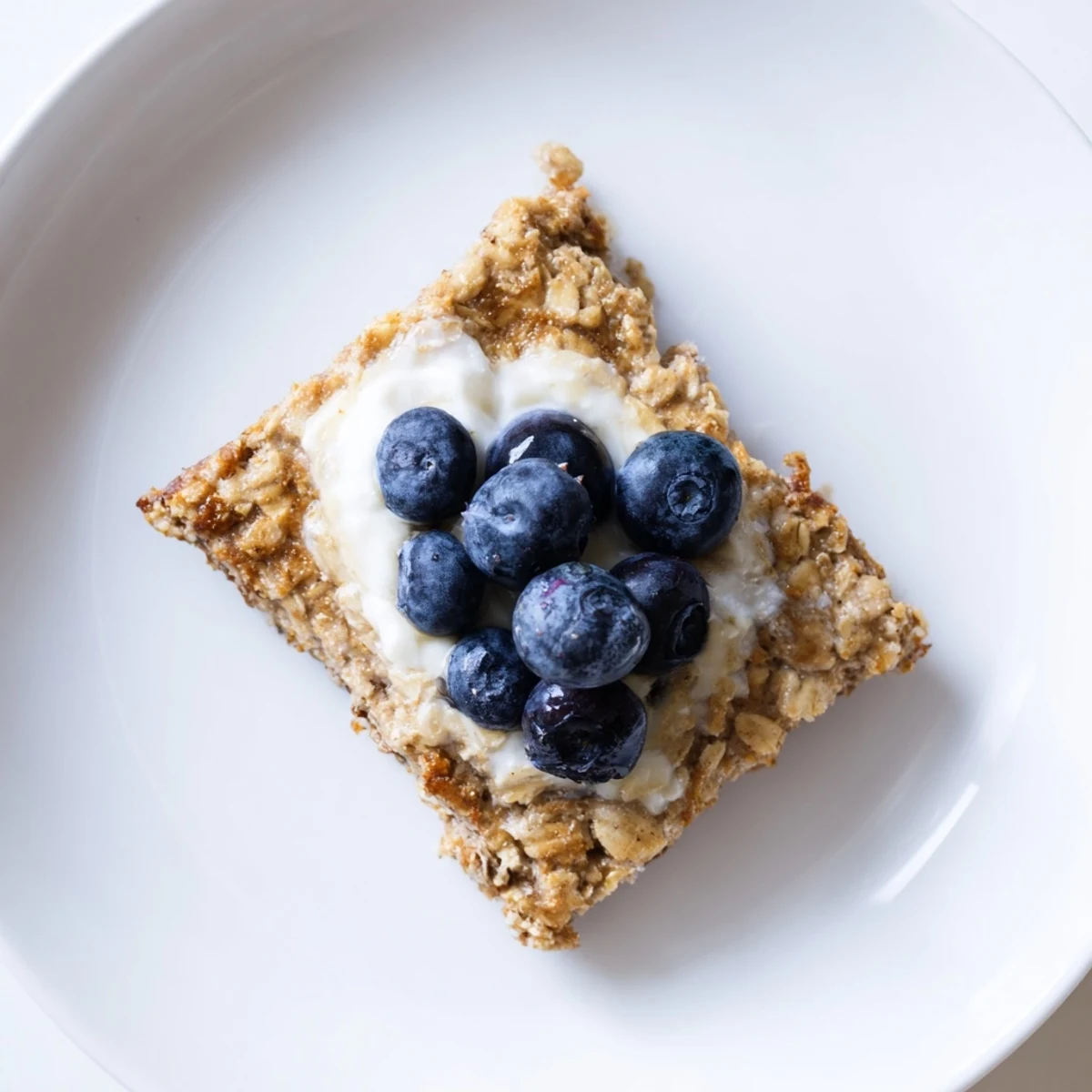 A warm, delicious photo of protein pancake oats; topped with fresh berries, ready to serve.