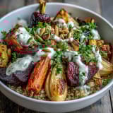 A nourishing roasted root vegetable bowl topped with fresh parsley and toasted pumpkin seeds for a wholesome dinner.  