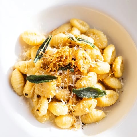 Golden-brown butter hugs delicate ditalini pasta, accented by crispy sage in this simple dish.