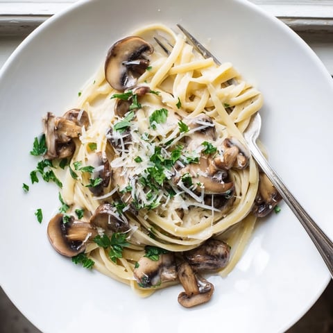 Creamy Mushroom Linguine features golden sautéed mushrooms enveloped in a silky garlic cream sauce over tender al dente pasta.
