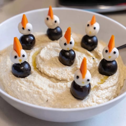 Festive Winter Dip image: imagine smooth white bean dip decorated with cute olive penguins.