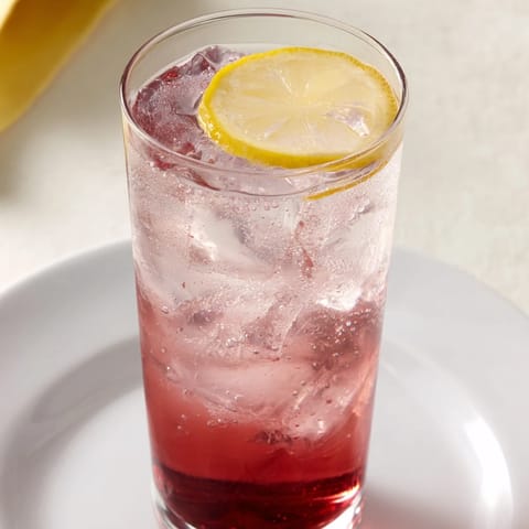 This vibrant Sleepy Girl Mocktail combines tart cherry juice and sparkling water; a calming drink.