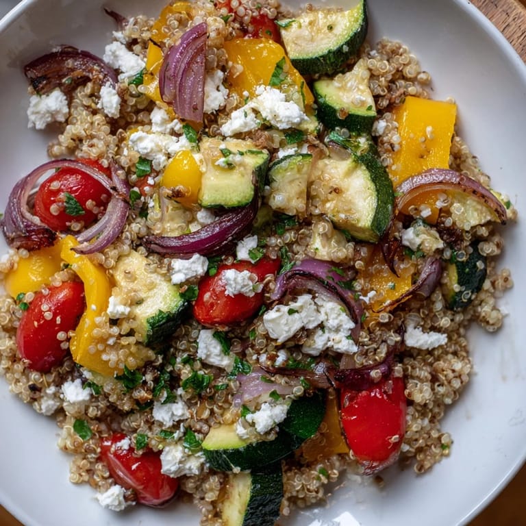 Wholesome Quinoa Salad with roasted vegetables and feta, bursting with Mediterranean flavors.