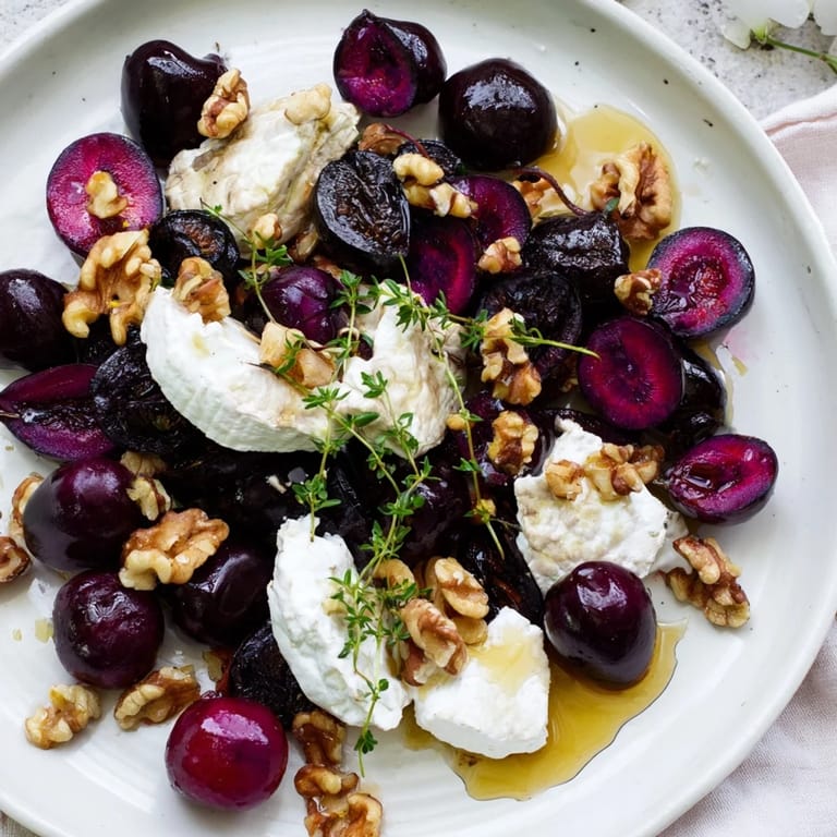 Vibrant Midnight Orchard appetizer layout featuring ripe plums, grapes, and goat cheese; perfect for sharing.