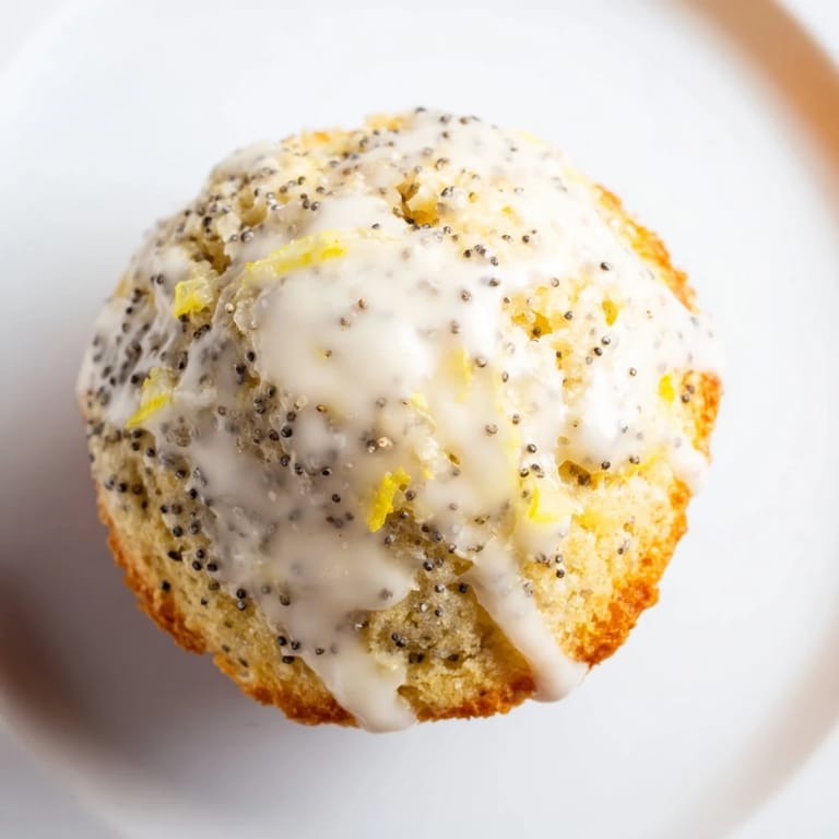 Fluffy Lemon Poppy Seed Muffins, drizzled with sweet lemon glaze, ready to brighten your morning.