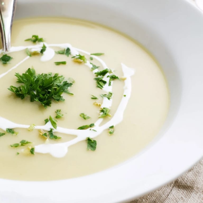 Golden roasted parsnips blended into velvety soup served with crusty bread for dipping.